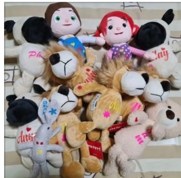 A pile of small personalized plush animals with different names
